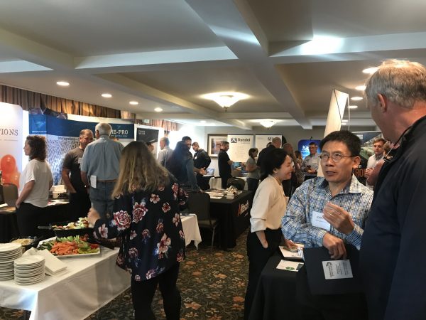 Delegates network in the trade show area of the USTFA Fall Conference. (Credit: Liza Mayer, ANA)